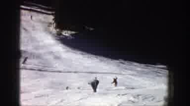 Aspen Colorado (1961): A Man In A Red Jacket Skiing Downhill On A Nice Sunny Day