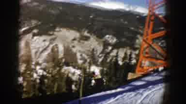 Aspen Colorado (1961): Two Adults Skiing On Snow During Daytime Surrounded With