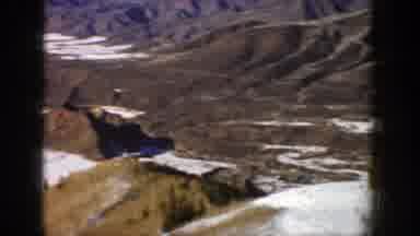 Aspen Colorado (1961): View Of Brown Mountains Melting Snow And Blue Sky On A