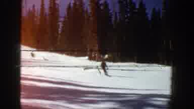 Aspen Colorado (1961): Person Wearing Yellow Jacket Skis Downhill On A Sunny Day