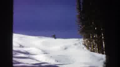 Aspen Colorado (1961): Person Skiing Down Mountain Slope Around Mounds Of Snow On