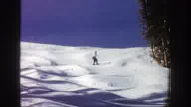 Aspen Colorado (1961): Two People With Ski Equipment In The Snow And Big And Tall