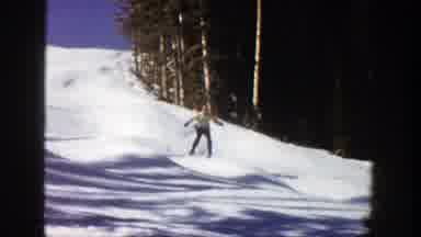 Aspen Colorado (1961): Alpine Skiers Going Downhill Over Moguls On A Bright Sunny