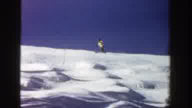 Aspen Colorado (1961): Two People Skiing Down Incline On Sunny Day In Snow With