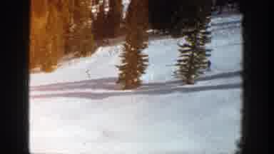 Aspen Colorado (1961): A Couple Of Skiers Skiing Down A Long Slope Short Video