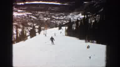 Aspen Colorado (1961): People Skiing Downhill On Fresh Snow At A Ski Resort