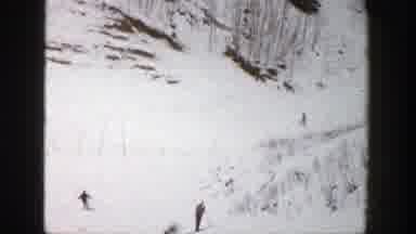 Aspen Colorado (1961): View Of People Skiing On Snow Covered Mountain On A Clear