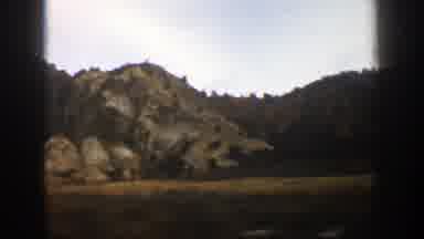 Aspen Colorado (1961): Traveling Car Fast On Road View Landscape With Peaks Sign