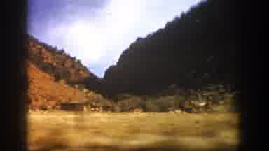 Aspen Colorado (1961): Driving On The Road A Lot Of Vegetation Advertising Signs
