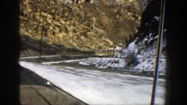 Aspen Colorado (1961): Looking Out The Window While Driving On A Mountain Road In