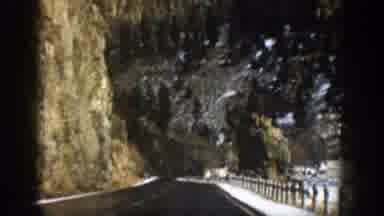 Aspen Colorado (1961): Car Ride On A Icy Wet Road Surrounding By Mountains