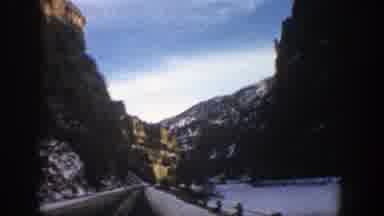 Aspen Colorado (1961): The View From A Car Driving Between Mountains On A Snow