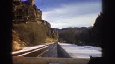 Aspen Colorado (1961): In Winter Driving Fast On Right Lane Of Divided Asphalt