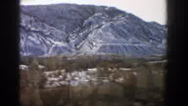 Aspen Colorado (1961): A Car Driving Down The Road And Off To The Right Hand Side