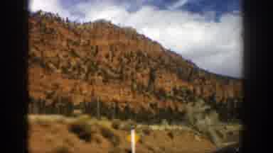 Aspen Colorado (1961): Driving On The Road Surrounded By Shrub Vegetation With