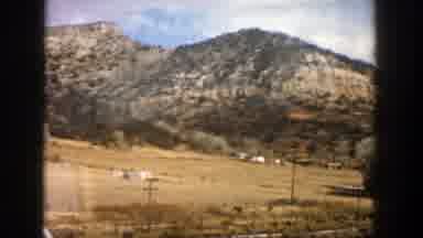 Aspen Colorado (1961): Road Trip Surrounded By Sandy Mountains And Large Trees