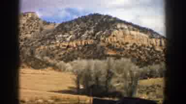 Aspen Colorado (1961): Driving On The Road With Side Landscape Of Many Trees