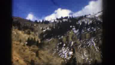 Aspen Colorado (1961): Traveling Down The Highway On A Clear Day The Mountains Are