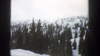 Aspen Colorado (1961): View Of Snow Covered Mountain And Trees On A Cloudy Day