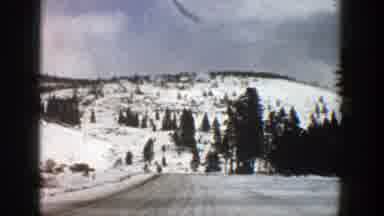 Aspen Colorado (1961): Driving On A Road Full Of Snow Between White Mountains And