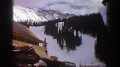 Aspen Colorado (1961): A Cabin Near A Lake During The Winter Time With Snow