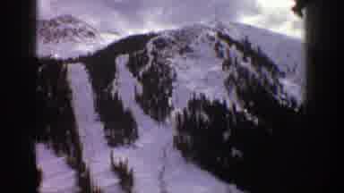 Aspen Colorado (1961): Snow-Covered Ski Runs Flanked By Conifer Trees Run Down The