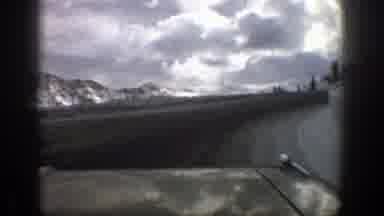 Aspen Colorado (1961): Approaching View Of Snow Covered Mountains And Grey Storm