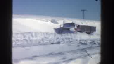 Aspen Colorado (1961): View Of Red Truck Half Buried In Snow On A Bright Sunny Day