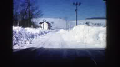 Aspen Colorado (1961): Driving By Car On Road Completely Covered With Snow