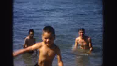 California (1952): Small Boy Runs Out Of Lake Water On A Sunny Day