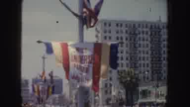 California (1952): Crowd Sitting On The Street Watches Flag Announcing Miss