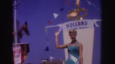California (1952): Beautiful Blonde Woman Waving To The Crowd During A Parade