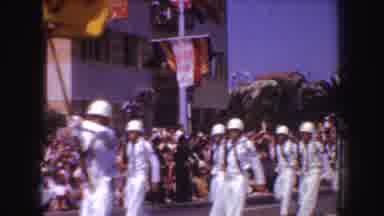 California (1952): People Dressed In White Fraying Marching In The Street