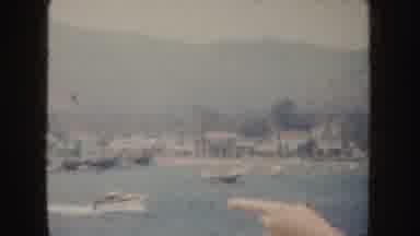California (1952): A Woman Points Out Boats In The Harbor While Her Fellow Tourist
