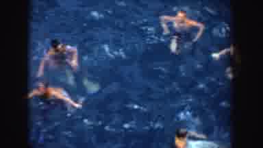 California (1952): A Large Group Of People Treading Water In A Body Of Water