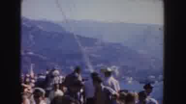 California (1952): People Looking At Mountains And Boat In Water On A Sunny Day