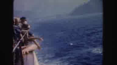 California (1952): People Looking At Blue Ocean Water From Edge Of White Boat On A