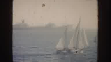 California (1952): View Of Two White Sailboats And Large Grey Ship On A Hazy Day
