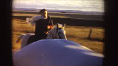 Idaho (1955): A Lady Horseback Riding Under The Sun Pause Beside Another Horse And