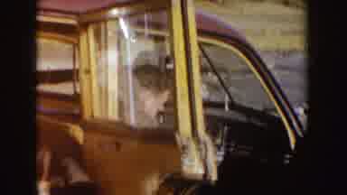 Idaho (1955): A Home Movie Depicting Two People Sitting In An Old Model Car On A