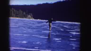 Idaho (1955): Several People Skating On A Large And Beautiful Frozen Lake With A