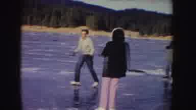 Idaho (1955): Group Of People Having Fun Skating On Frozen Ground Fish Trees