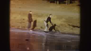 Idaho (1955): Person Wearing Black Jacket Makes Small Jump On Ice Skates On A