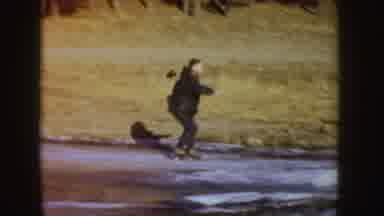 Idaho (1955): People Ice Skating On Ice At A Park And Falling