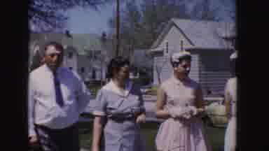 Idaho (1955): Man In Shirt Standing With Women In White And Woman In Blue Dress In