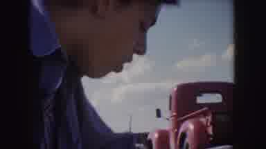 Idaho (1955): Young Man And Woman Talking A Red Truck Is Seen In The Background