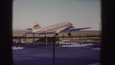 Idaho (1955): Large Blue White And Red Plane Landing From Airport Runway