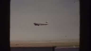 Idaho (1955): Two People Riding Horses And Grey Plane Taking Off Into Sky On A