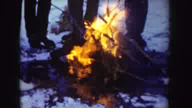 Idaho (1955): White People Huddled Next To A Fire In The Tundra To Keep Warm