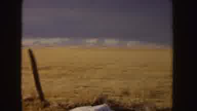 Idaho (1955): Nurse Wearing Black Cape Walks With Man Wearing Grey Suit